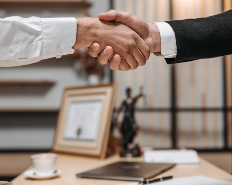 doing a handshake with a lawyer